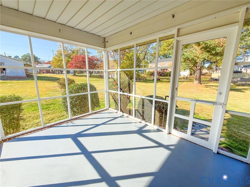 109 Rock Castle Avenue, Crewe, VA 23930 Enclosed porch featuring white framing, a screen enclosure, and solid surface flooring