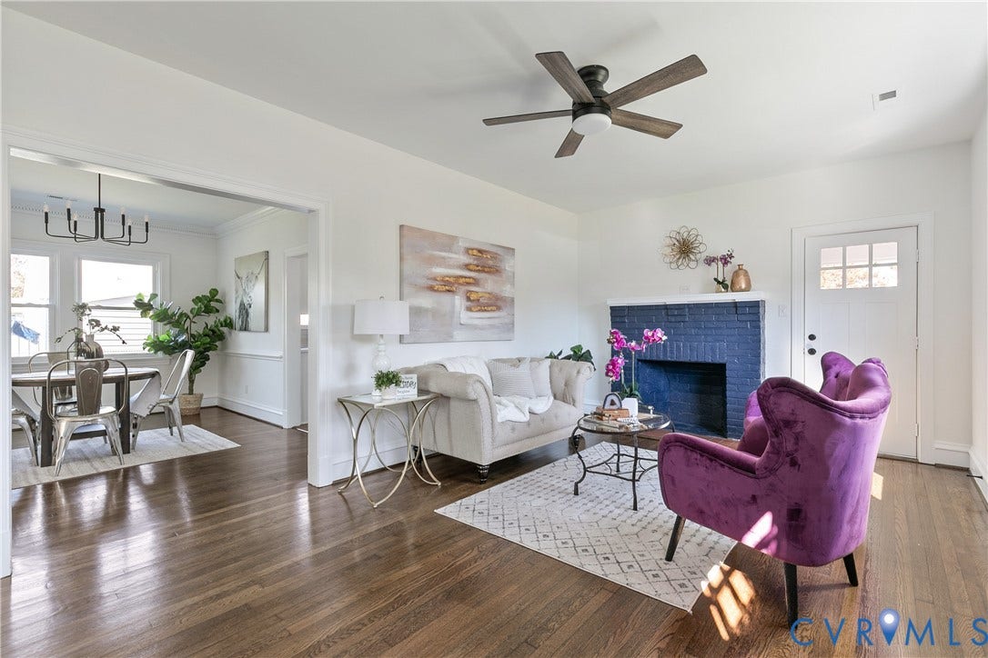 24 N Elm Avenue, Henrico, VA 23075 Living area featuring dark wood-finish flooring, a painted brick fireplace, a ceiling fan, and a six-pane entry door