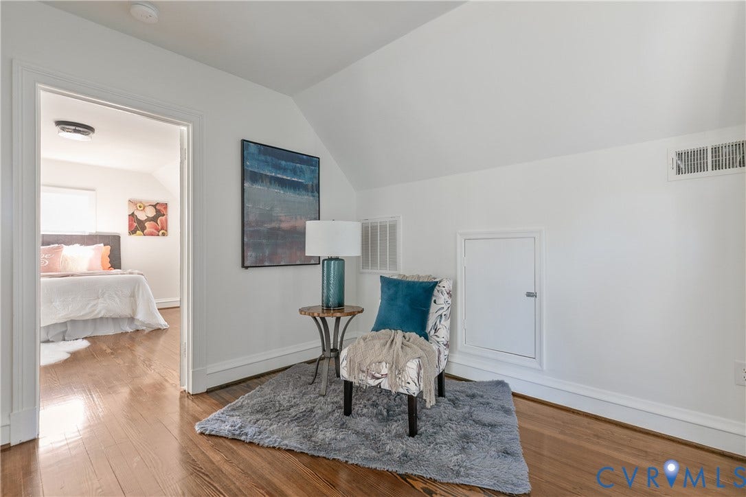 24 N Elm Avenue, Henrico, VA 23075 Sloped ceiling design featuring wood-finish flooring and a built-in wall access panel
