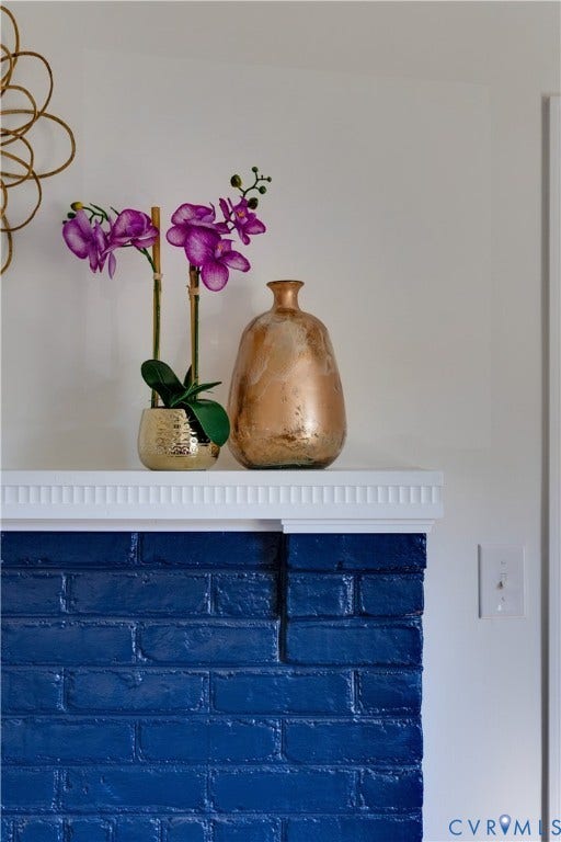 24 N Elm Avenue, Henrico, VA 23075 Painted brick fireplace surround with a white fluted crown molding mantel
