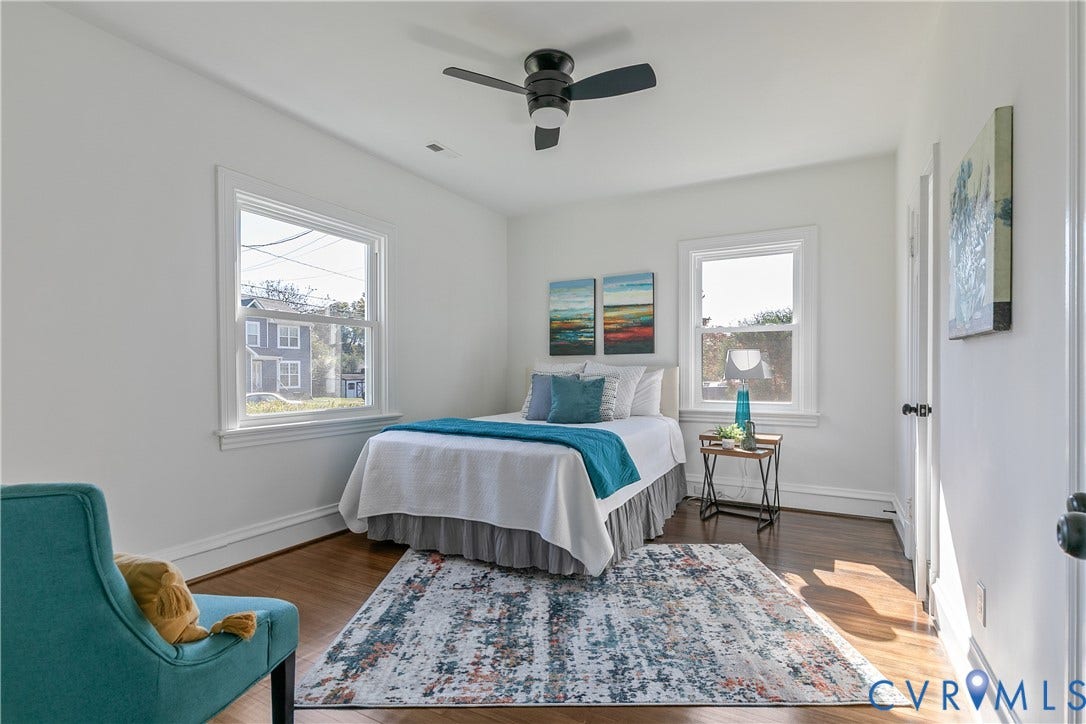 24 N Elm Avenue, Henrico, VA 23075 Bedroom featuring wood-finish flooring, dual windows, and a matte black ceiling fan