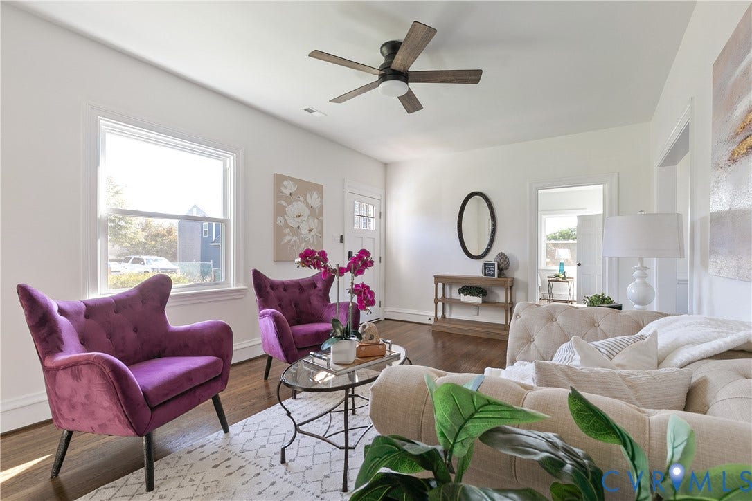 24 N Elm Avenue, Henrico, VA 23075 Living space featuring wood-finish flooring, large multi-pane window, and a central ceiling fan with integrated lighting