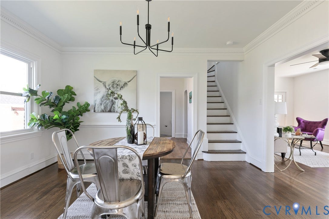 24 N Elm Avenue, Henrico, VA 23075 Wood-finish flooring, crown molding, chair rail trim, black metal six-light chandelier, and a painted wooden staircase