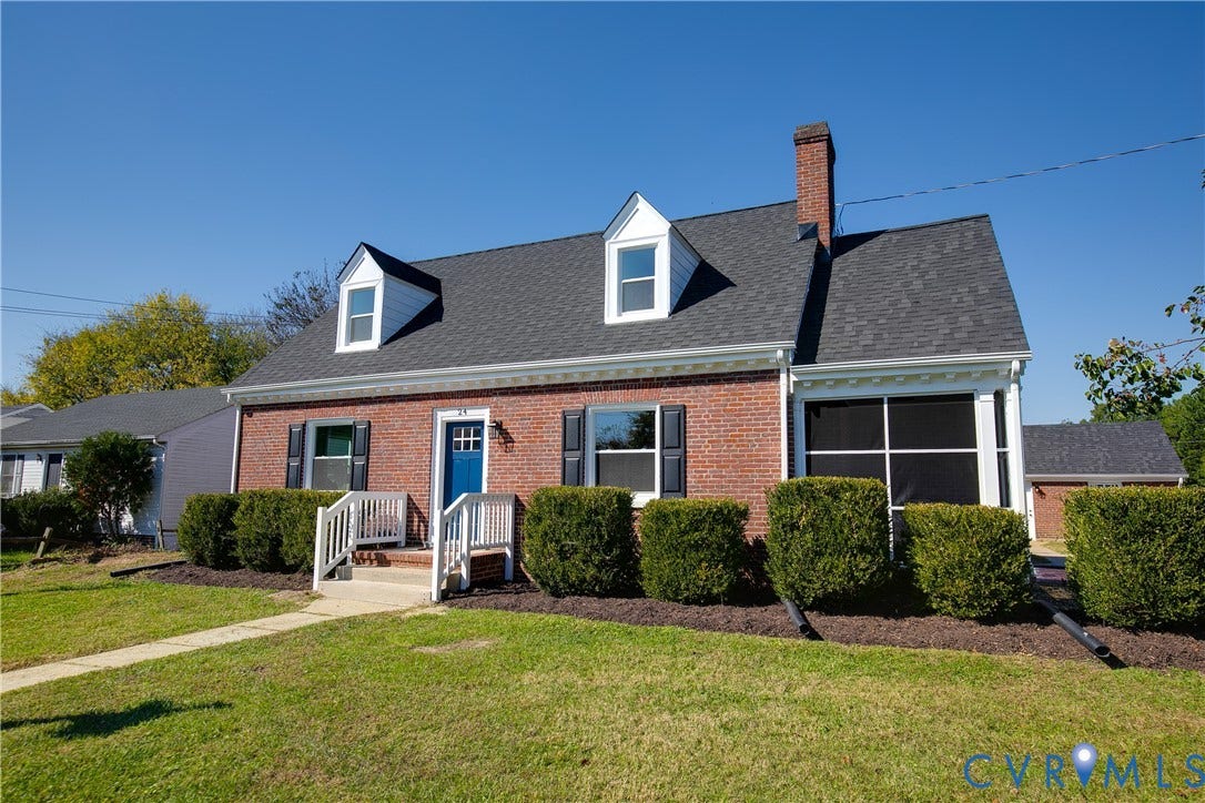 24 N Elm Avenue, Henrico, VA 23075 Classic brick exterior featuring two gabled dormers, a prominent masonry chimney, white shuttered windows, and a screened-in porch