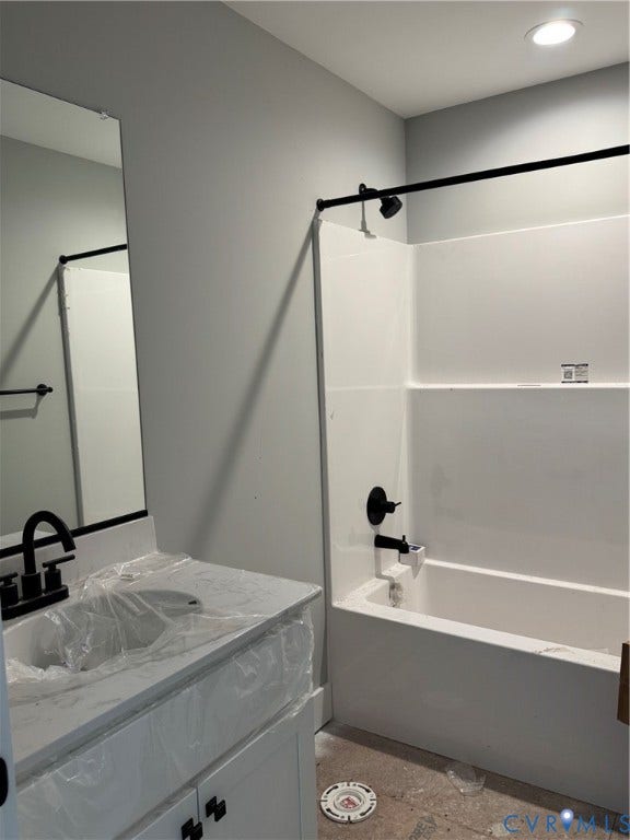 6012 Lakeside Drive, Woodhaven Shores, Quinton, VA 23141 Bathroom featuring a vanity with a white composite countertop, undermount sink, matte black faucet, wall-mounted mirror, and a shower-tub combination with matte black fixtures