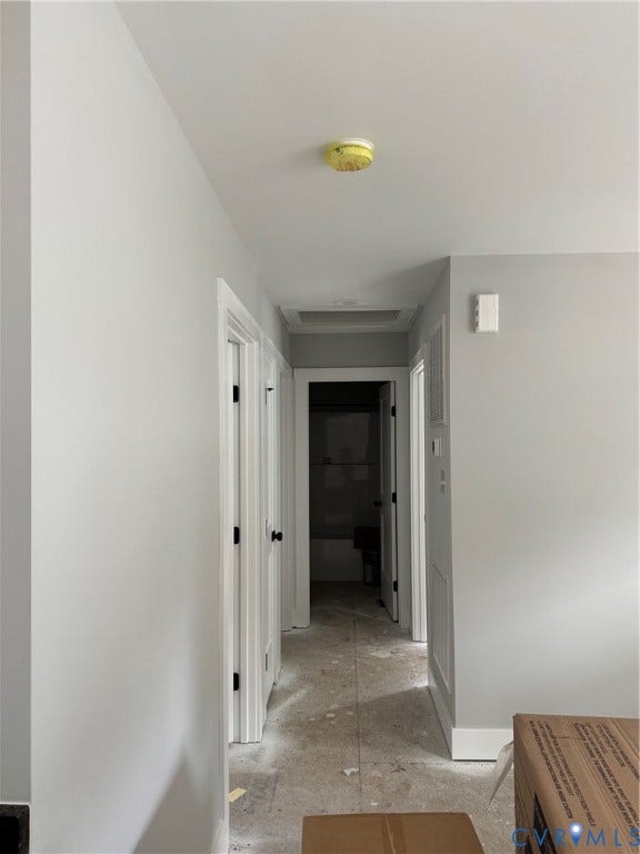 6012 Lakeside Drive, Woodhaven Shores, Quinton, VA 23141 Neutral-toned interior hallway with white door casing, matte black hardware, and an integrated ceiling access panel