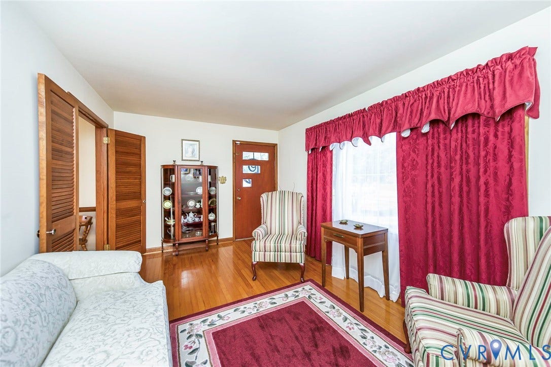 700 Lakeside Drive, Emporia, Emporia, VA 23847 Hardwood flooring, wood-panel door with decorative glass inserts, and louvered wood interior doors