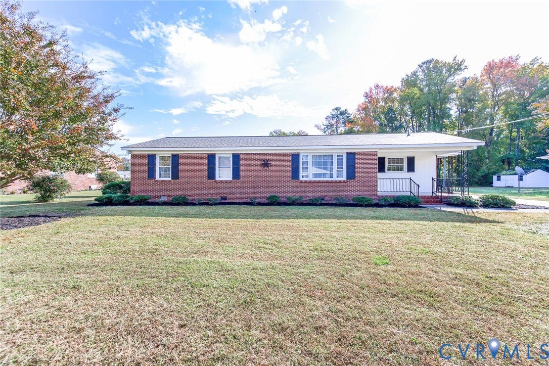 700 Lakeside Drive, Emporia, Emporia, VA 23847 Single-story brick exterior featuring a low-pitched roof, decorative window shutters, and a covered porch area with metal railings