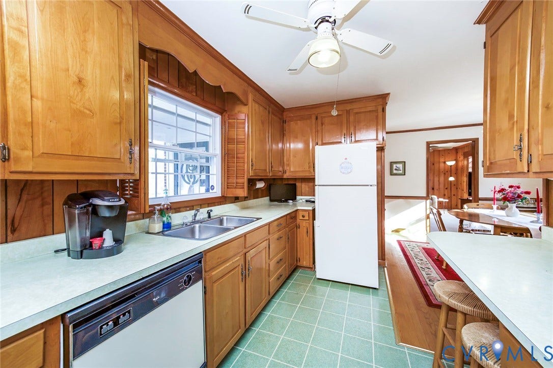 700 Lakeside Drive, Emporia, Emporia, VA 23847 Kitchen featuring natural wood cabinetry, solid surface countertops, dual-basin stainless steel sink, tiled flooring, and a ceiling-mounted light fixture