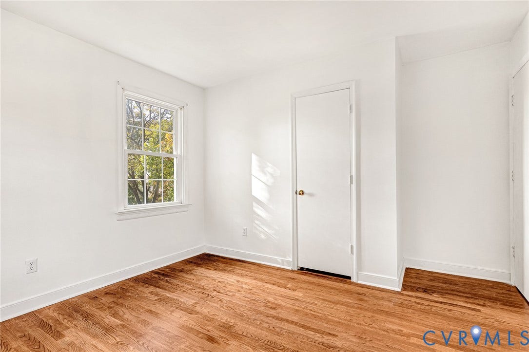 1526 Westshire Lane, Henrico, VA 23238 Room featuring wood-finish flooring, white walls, and a multi-pane window