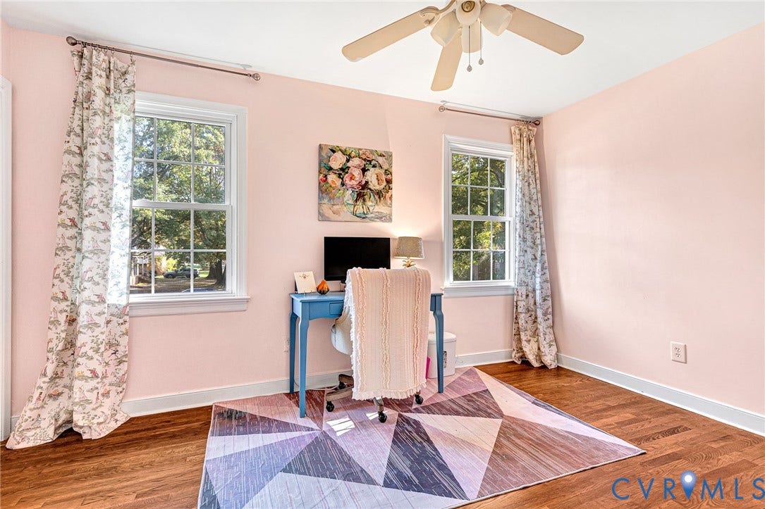 1526 Westshire Lane, Henrico, VA 23238 Room featuring wood-finish flooring, two double-hung windows, and a ceiling fan with integrated lighting