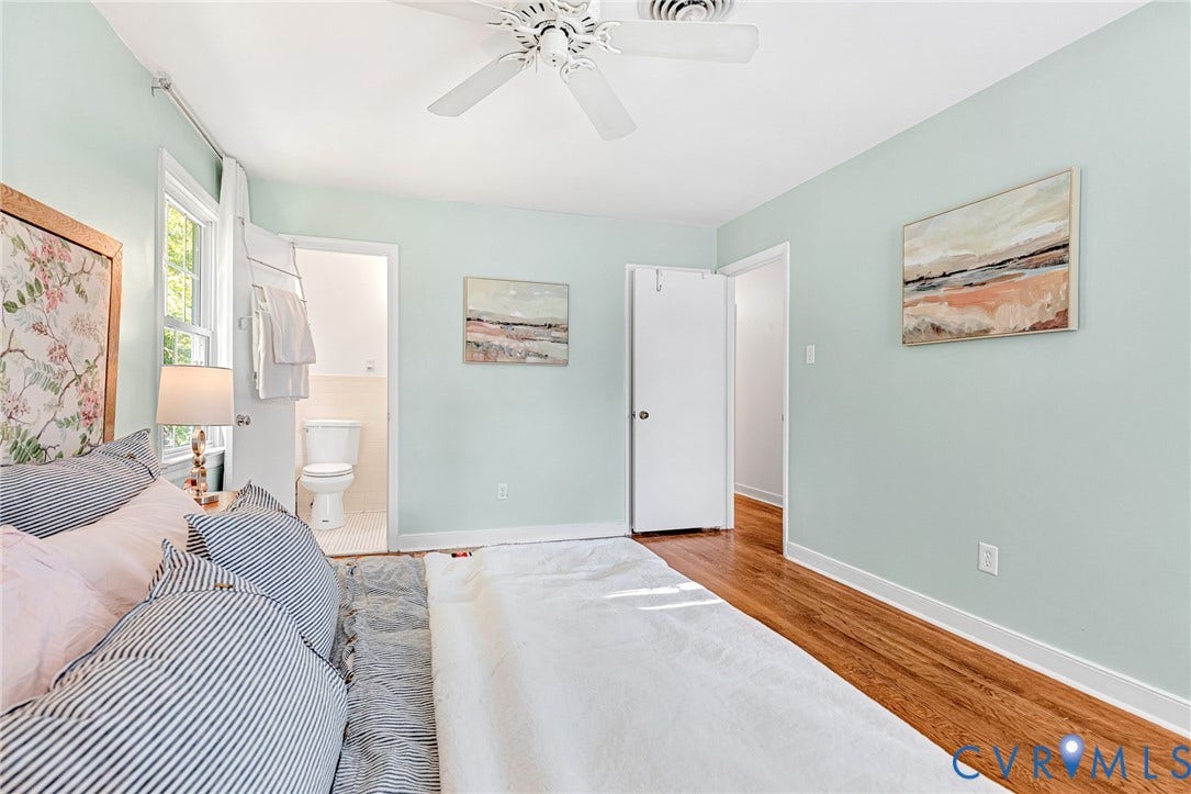 1526 Westshire Lane, Henrico, VA 23238 Bedroom featuring wood-finish flooring, a white ceiling fan, and a neutral color palette