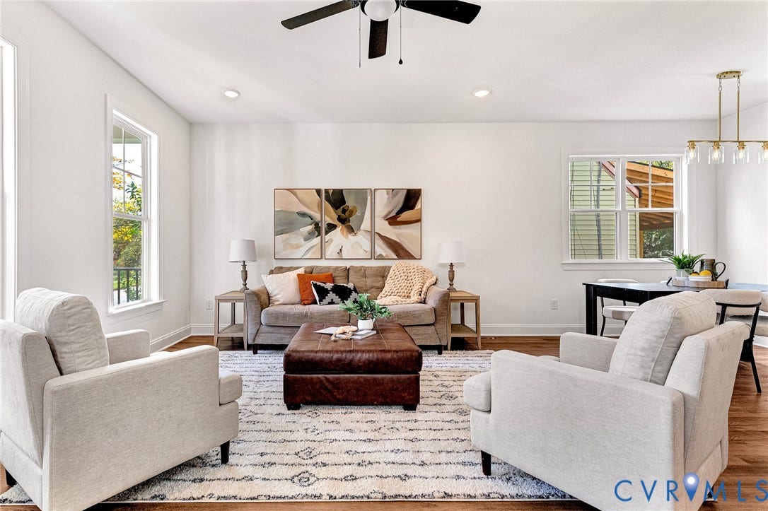 1807.5 Gordon Avenue, Oak Grove, Oak Grove, VA 23224 Open-concept interior featuring wood-finish flooring, recessed lighting, a matte black ceiling fan, and multi-light brushed gold chandelier