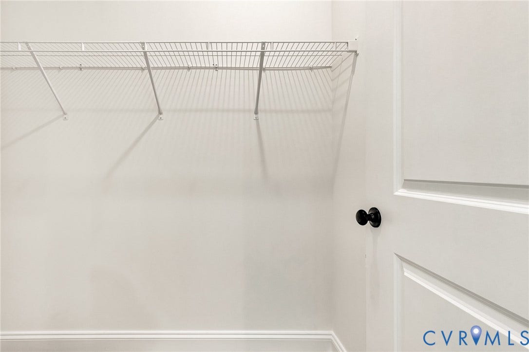 1807.5 Gordon Avenue, Oak Grove, Oak Grove, VA 23224 Storage area featuring white paneled door with matte black hardware and white wire shelving