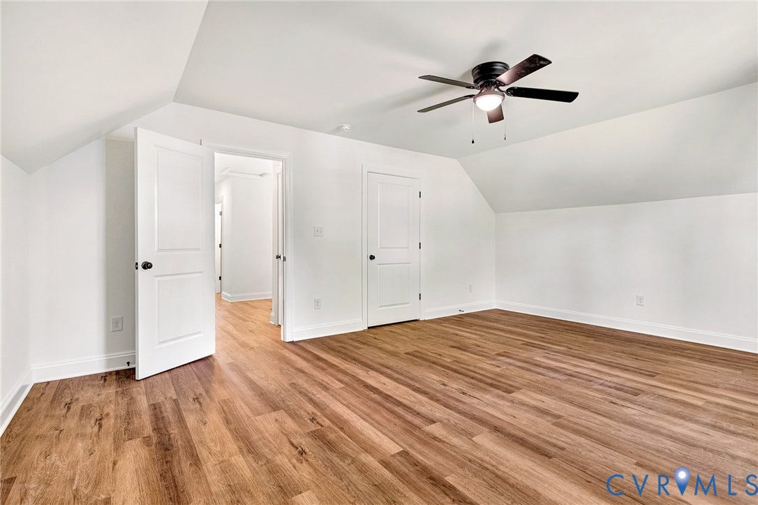 1807.5 Gordon Avenue, Oak Grove, Oak Grove, VA 23224 Room featuring wood-finish flooring, vaulted ceilings, and a central ceiling fan with an integrated light fixture