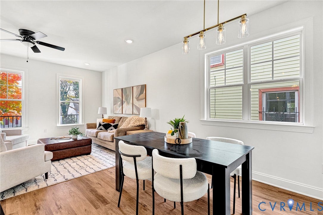 1807.5 Gordon Avenue, Oak Grove, Oak Grove, VA 23224 Open-concept room featuring wood-finish flooring, multi-pane windows, recessed ceiling lighting, a matte black ceiling fan, and a four-light linear pendant fixture