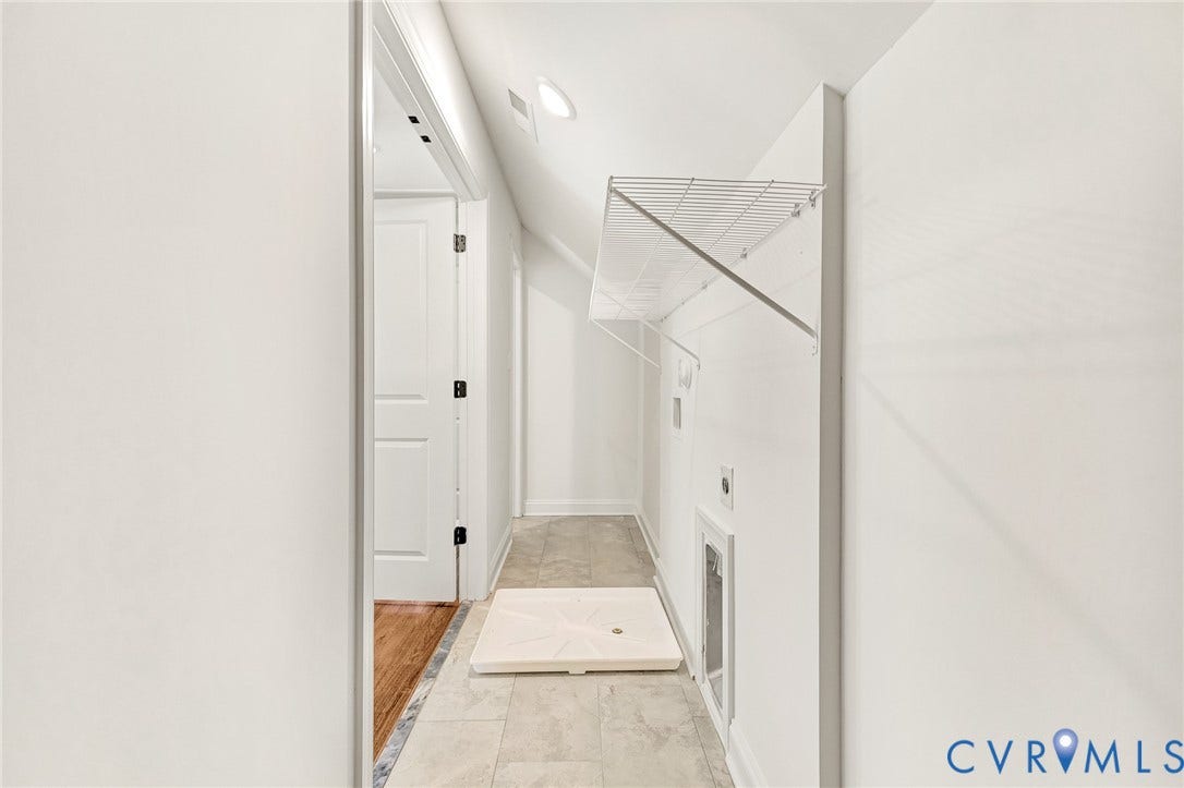 1807.5 Gordon Avenue, Oak Grove, Oak Grove, VA 23224 Utility space featuring tile flooring, white wall-mounted wire shelving, and recessed ceiling lighting