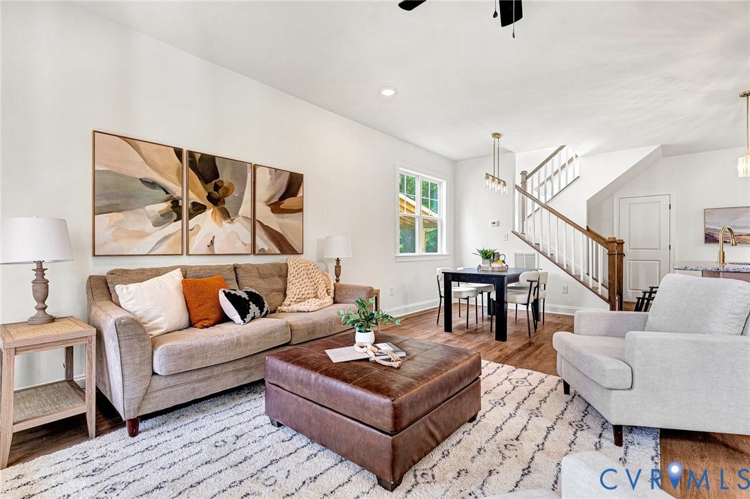 1807.5 Gordon Avenue, Oak Grove, Oak Grove, VA 23224 Living area featuring wood-finish flooring, recessed lighting, and a staircase with a stained wood handrail and white balusters