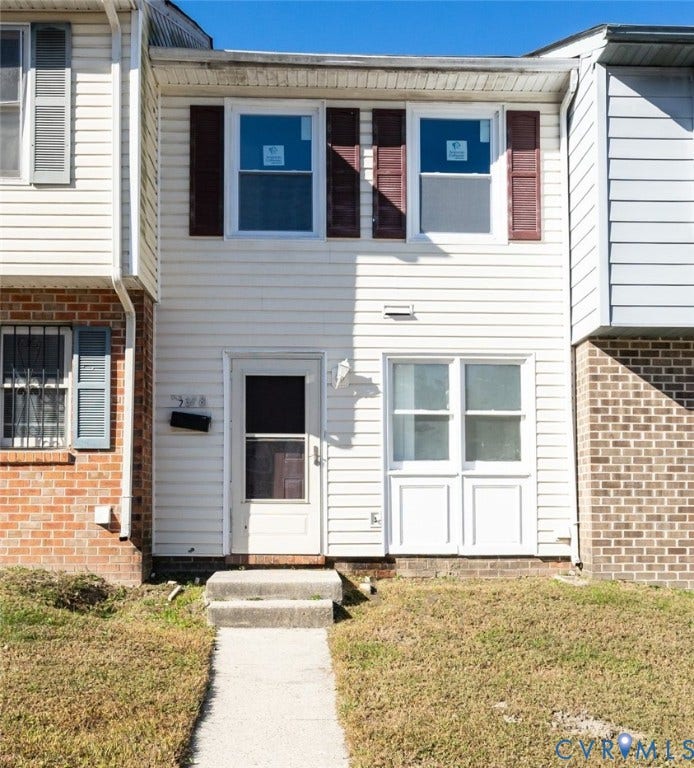 2358 Hill Street, #G, Petersburg, VA 23803 Exterior facade featuring horizontal siding, decorative shutters, brick masonry accents, and a concrete walkway