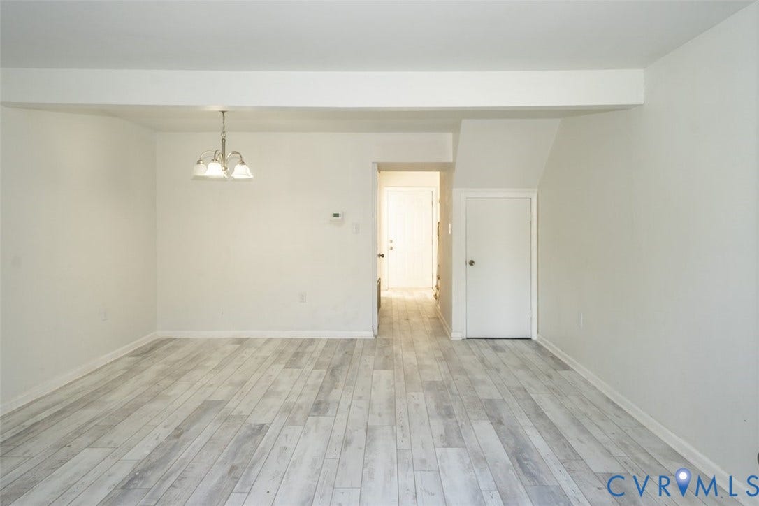 2358 Hill Street, #G, Petersburg, VA 23803 Interior space featuring wood-finish flooring, neutral wall tones, and a multi-light overhead pendant fixture