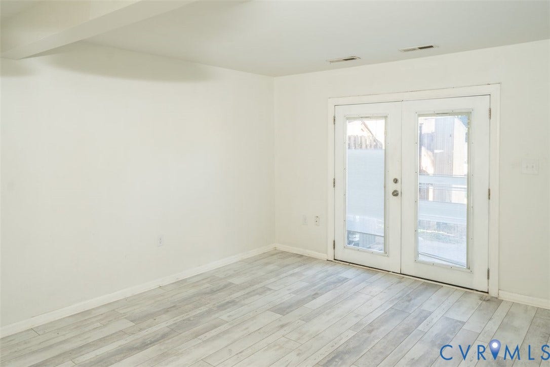 2358 Hill Street, #G, Petersburg, VA 23803 Interior space featuring wood-finish flooring and double glass-paned doors with white trim