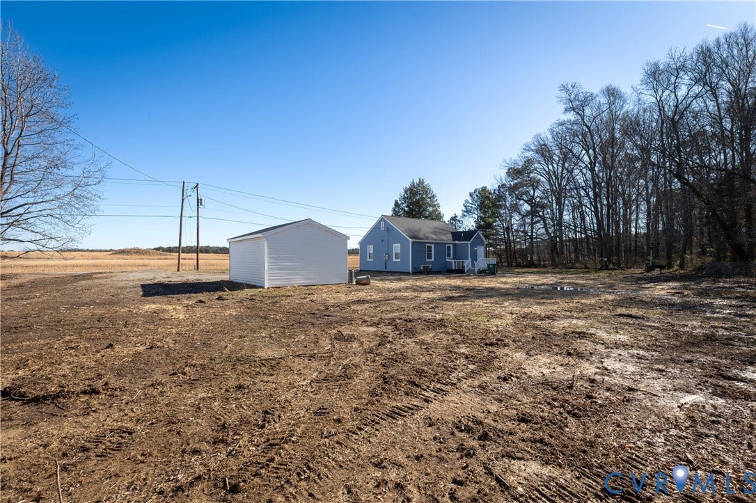 6280 Monahan Road, Henrico, VA 23231 Detached dwelling with a neutral-toned exterior, standalone storage structure, and expansive acreage