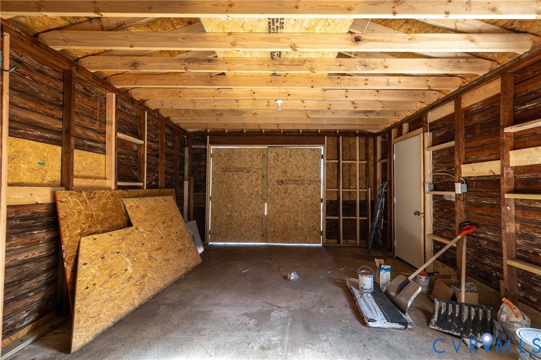 6280 Monahan Road, Henrico, VA 23231 Detached structure with an exposed timber-frame ceiling, wood-plank walls, concrete flooring, and double-door entry