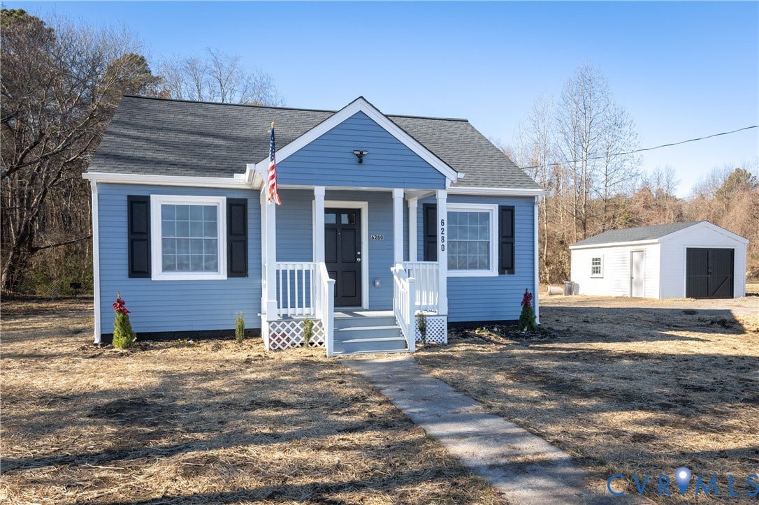 6280 Monahan Road, Henrico, VA 23231 Single-story residence featuring blue lap siding, a covered front porch with white railing, a shingled gable roof, and a detached structure