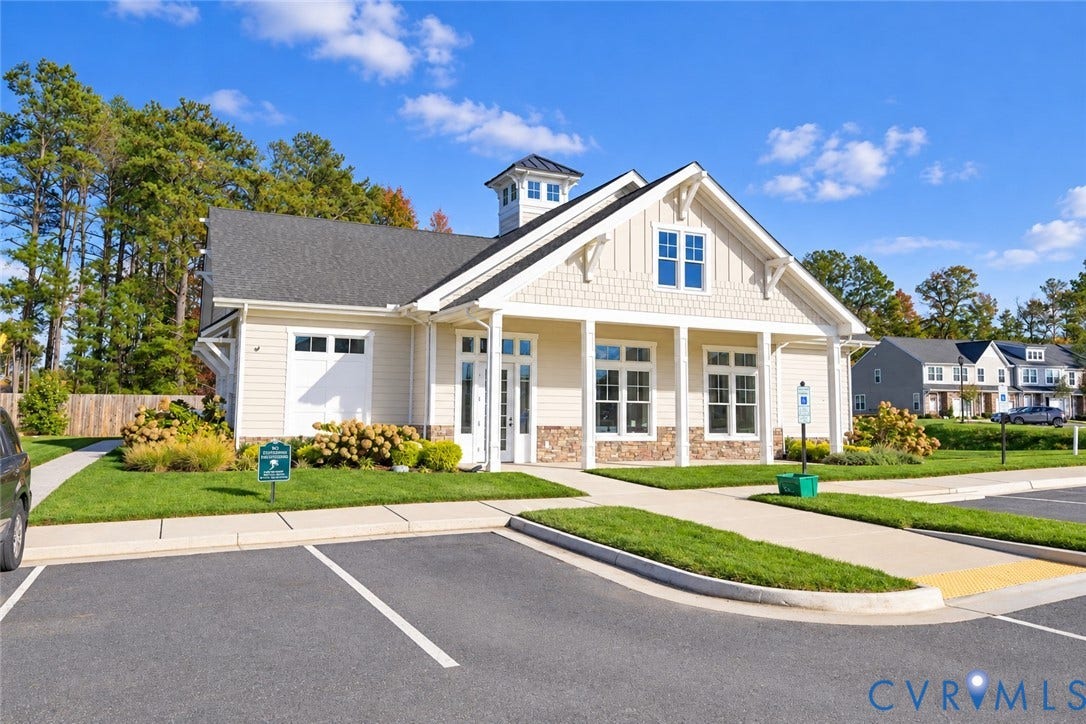 500 Rivanna Hill Way, Glen Allen, VA 23060 Craftsman-style exterior featuring horizontal lap siding, shake-shingle accents, a stone veneer base, a roof-mounted cupola, and a covered front porch