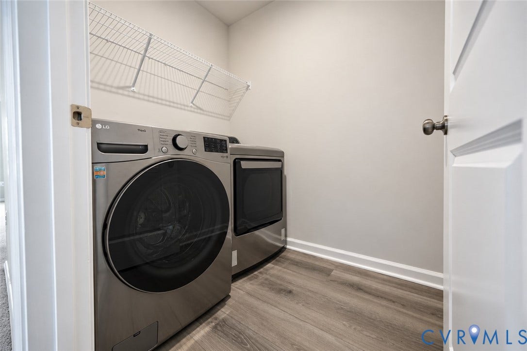 500 Rivanna Hill Way, Glen Allen, VA 23060 Laundry area featuring wood-finish flooring, neutral wall tones, and overhead wire shelving