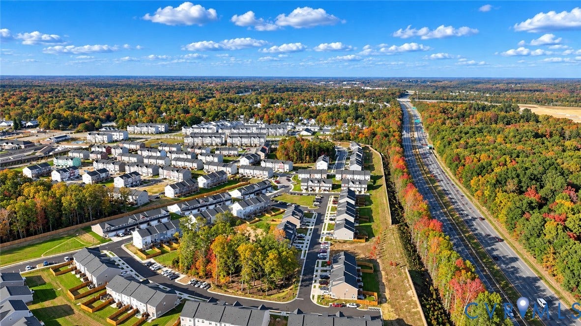 500 Rivanna Hill Way, Glen Allen, VA 23060 Aerial perspective of a multi-unit residential community featuring asphalt roadways, perimeter greenery, paved parking surfaces, and proximity to regional infrastructure