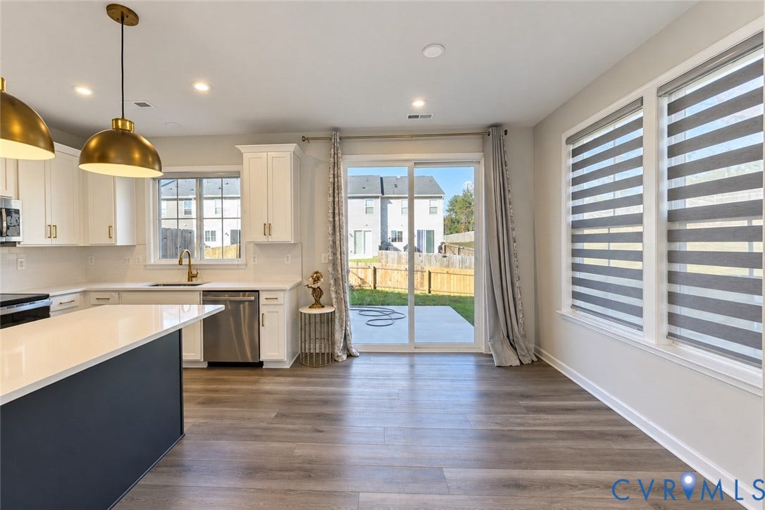 500 Rivanna Hill Way, Glen Allen, VA 23060 Kitchen featuring white cabinetry, quartz countertops, a contrasting dark-toned kitchen island, wood-finish flooring, and recessed lighting