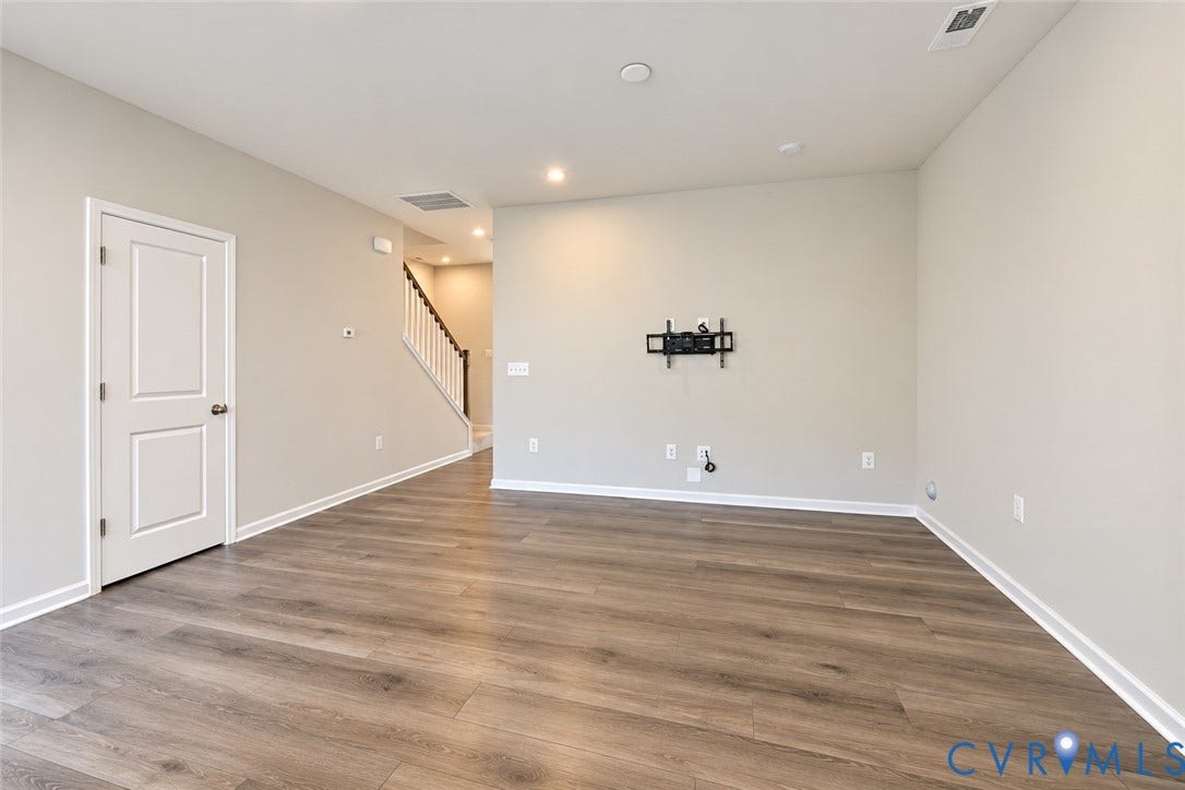 500 Rivanna Hill Way, Glen Allen, VA 23060 Open-concept interior featuring wood-finish flooring, recessed lighting, and a neutral wall palette