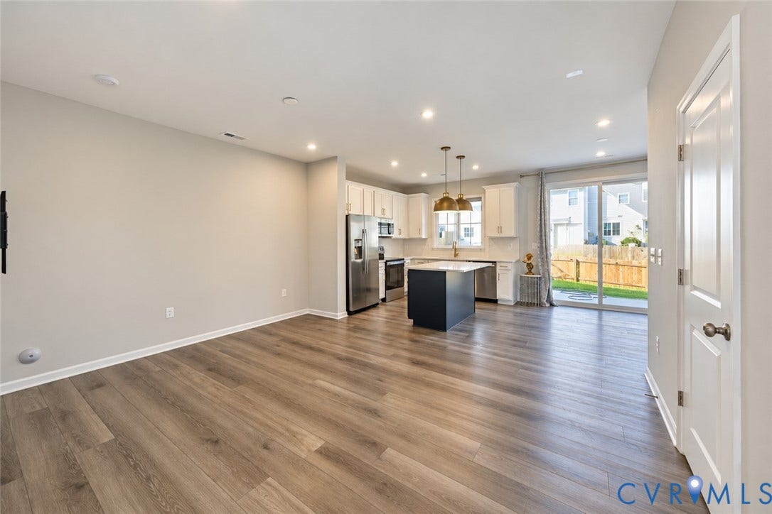 500 Rivanna Hill Way, Glen Allen, VA 23060 Kitchen featuring white cabinetry, a center island with a dark base, stainless steel appliances, recessed lighting, and wood-finish flooring