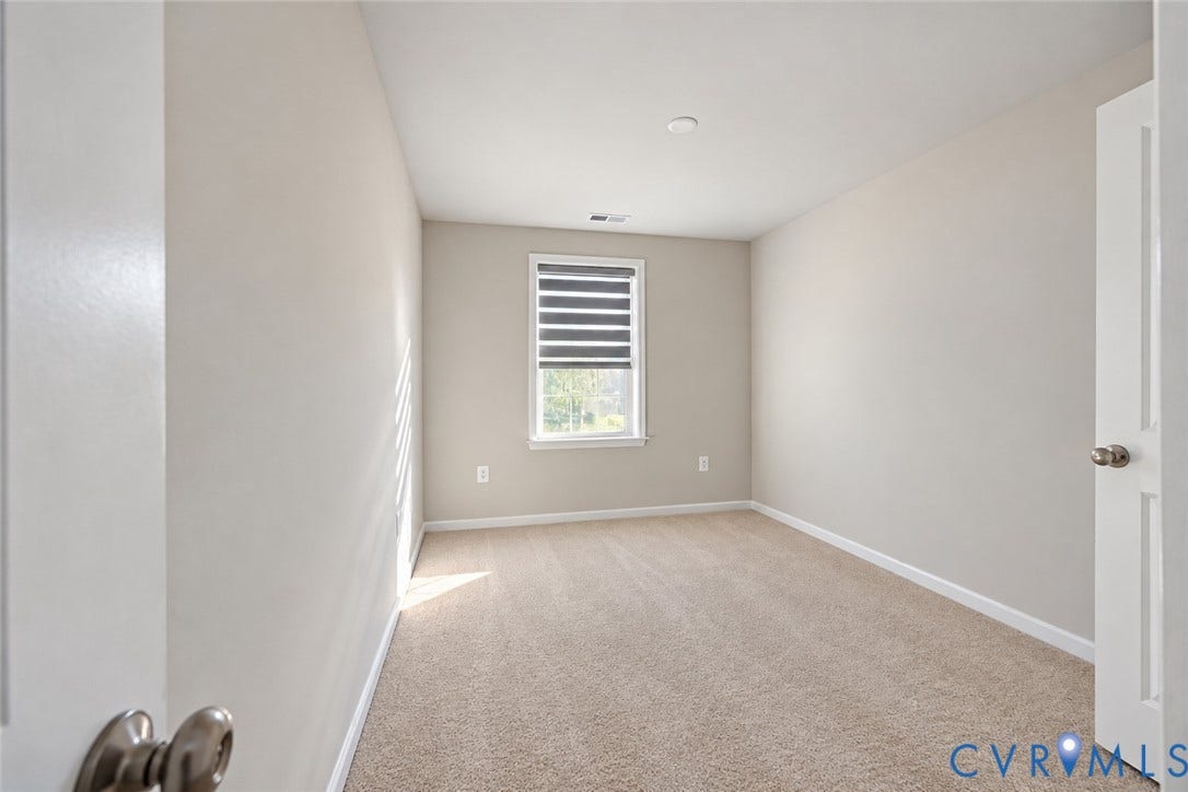 500 Rivanna Hill Way, Glen Allen, VA 23060 Neutral-toned interior space featuring wall-to-wall carpeting and a single window equipped with an integrated dual-shade blind