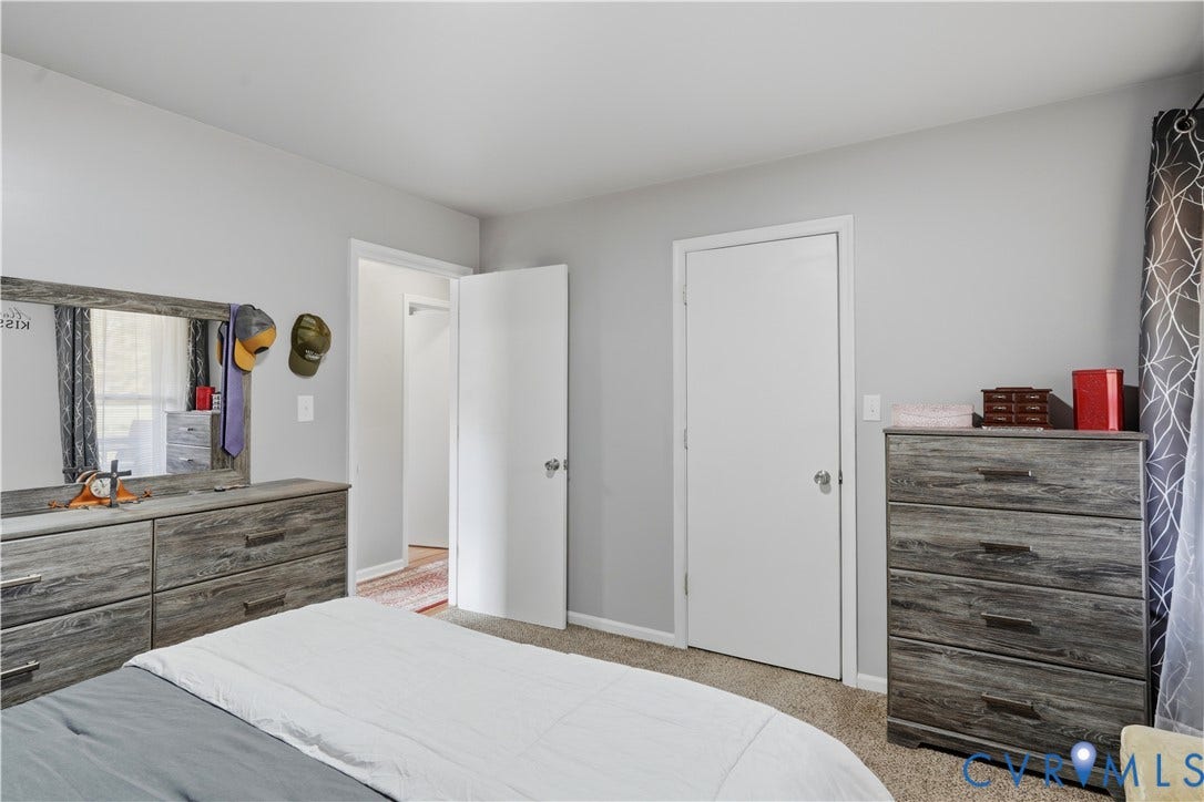 16401 Anderson Drive, Disputanta, VA 23833 Neutral wall paint, plush carpeting, and two interior doors with hardware
