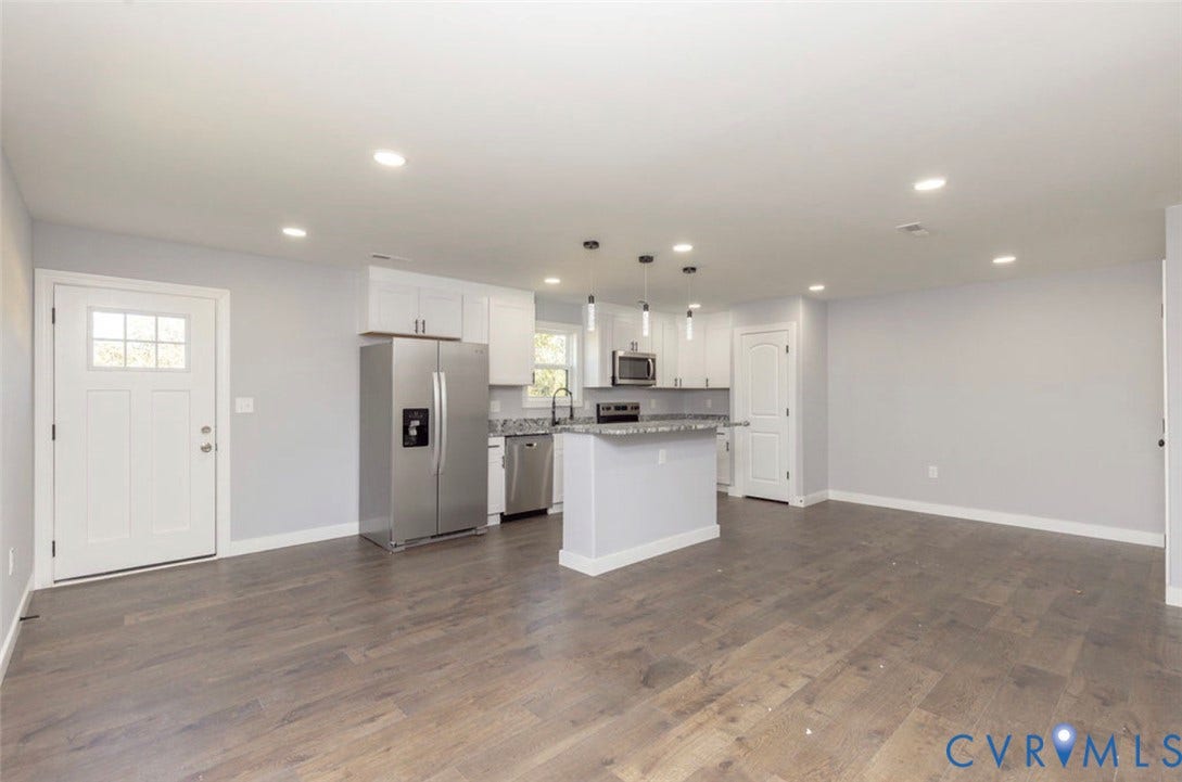 25604 Greensville Avenue, West Petersburg, Dinwiddie, VA 23803 Kitchen featuring white shaker-style cabinetry, stone-surface countertops, stainless steel appliances, a center island with pendant lighting, and wood-finish flooring