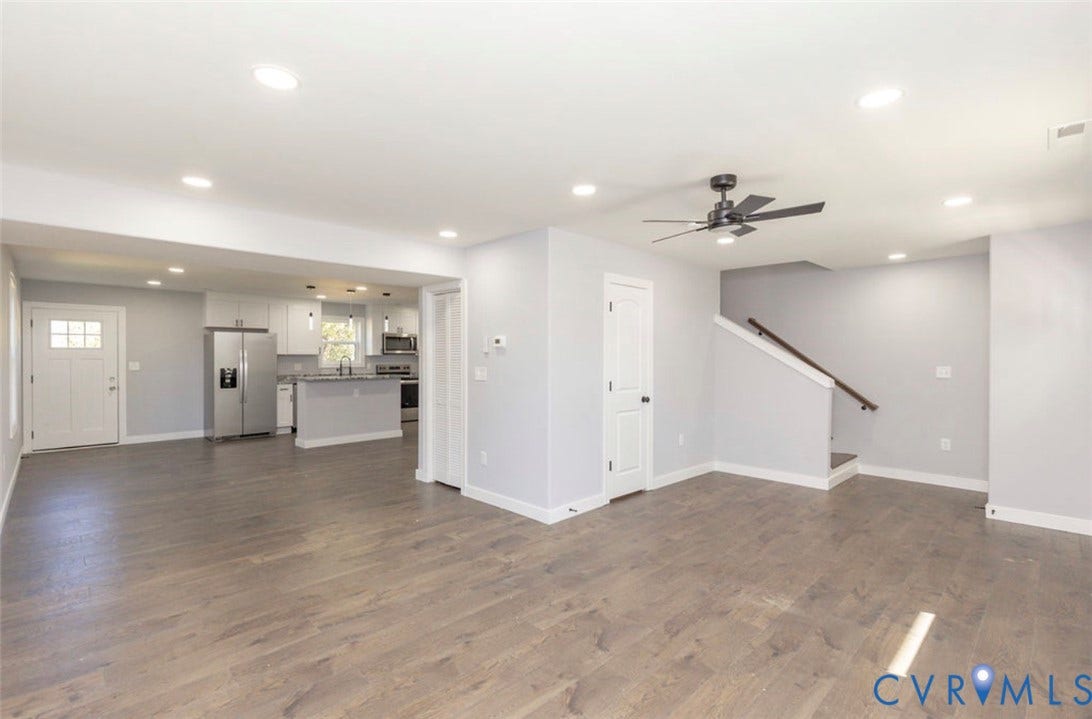 25604 Greensville Avenue, West Petersburg, Dinwiddie, VA 23803 Open-concept interior featuring wood-finish flooring, recessed lighting, a modern ceiling fan, and white kitchen cabinetry with a peninsula