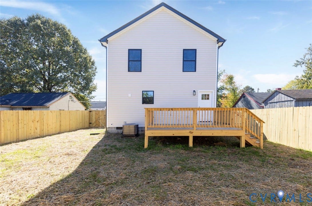 25604 Greensville Avenue, West Petersburg, Dinwiddie, VA 23803 Exterior view featuring light-toned horizontal siding, a raised wood deck, and a fenced backyard