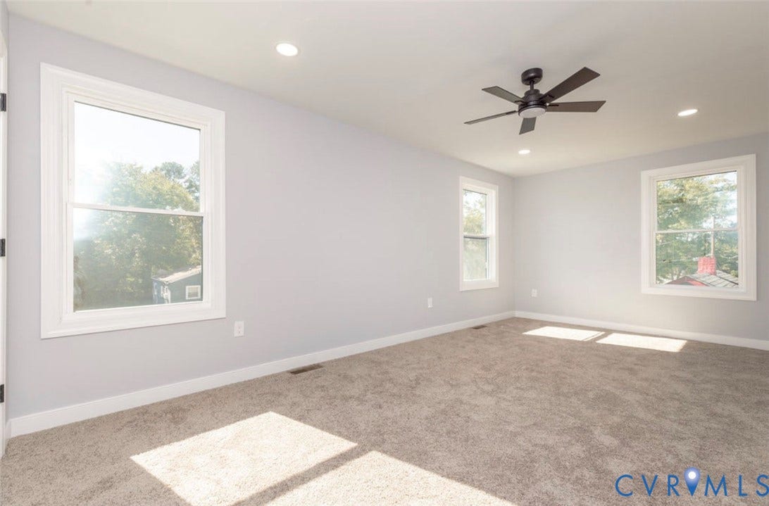 25604 Greensville Avenue, West Petersburg, Dinwiddie, VA 23803 Neutral-toned interior room featuring wall-to-wall carpeting, recessed ceiling lighting, a dark-finish ceiling fan, and multi-pane windows