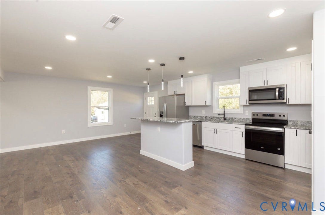 25604 Greensville Avenue, West Petersburg, Dinwiddie, VA 23803 Kitchen featuring white cabinetry, stone-surface countertops, stainless steel appliances, wood-finish flooring, and pendant lighting