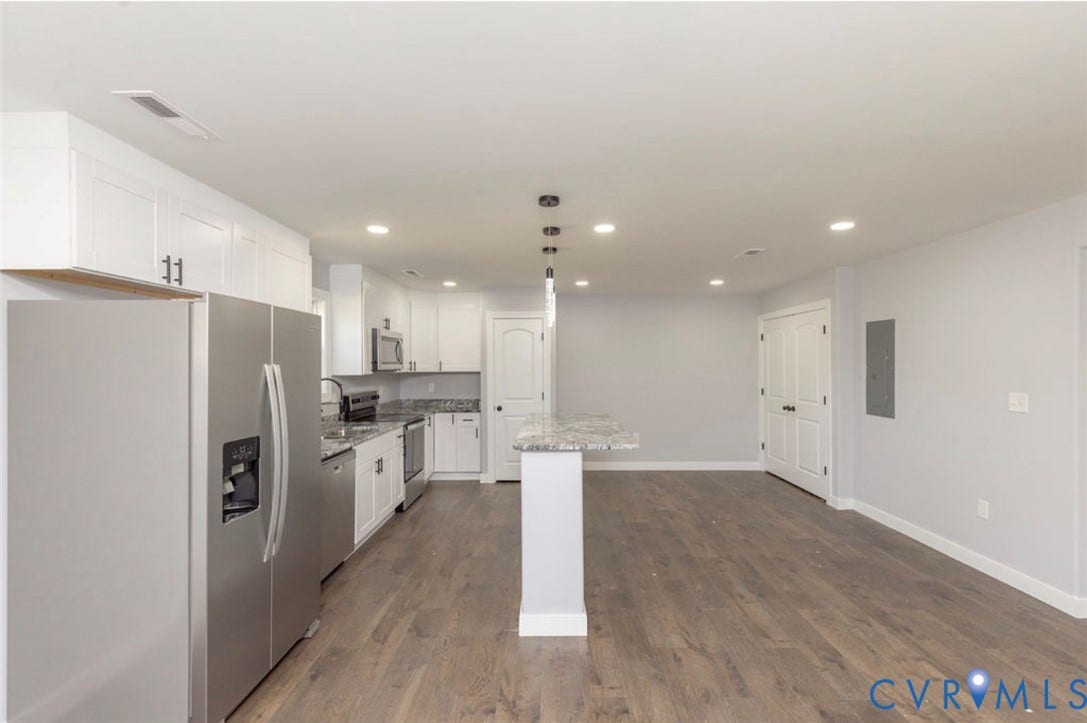 25604 Greensville Avenue, West Petersburg, Dinwiddie, VA 23803 Kitchen featuring white cabinetry, stone-finish countertops, stainless steel appliances, a center island with pendant lighting, and wood-finish flooring