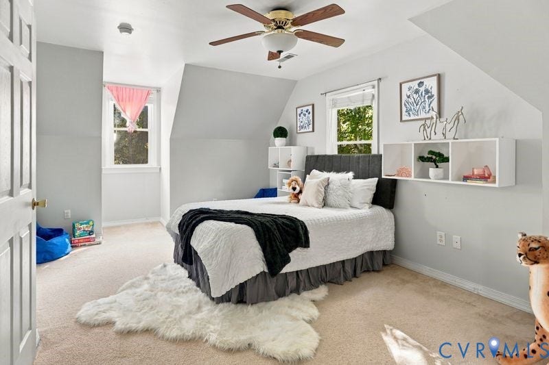 10208 Claybar Trail, Chesterfield, VA 23236 Bedroom featuring vaulted ceilings, wall-mounted white storage shelving, carpeting, and a central ceiling fan with integrated lighting