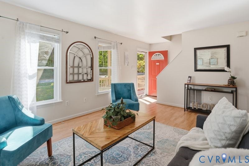 10208 Claybar Trail, Chesterfield, VA 23236 Interior space featuring wood-finish flooring, dual windows with natural light, and a prominent solid-color entry door