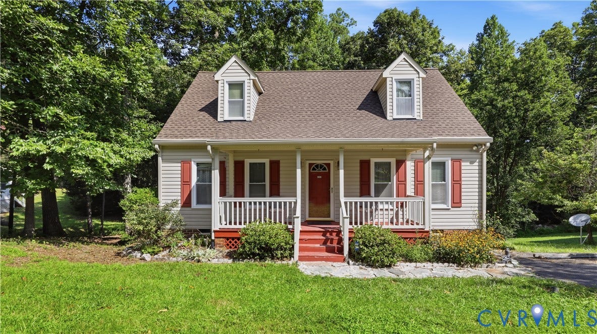 10208 Claybar Trail, Chesterfield, VA 23236 Cape Cod-style residence featuring horizontal siding, a covered front porch with white railing, twin dormer windows, and a shingled roof