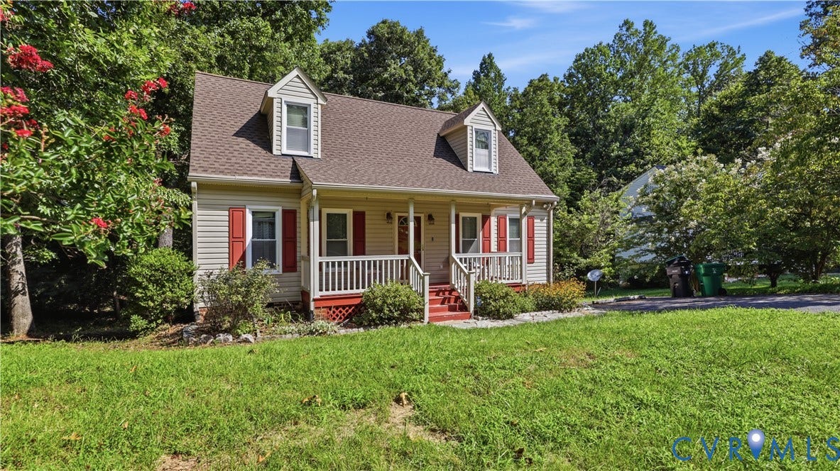 10208 Claybar Trail, Chesterfield, VA 23236 Cape Cod-style residence featuring horizontal siding, dual roof dormers, a covered front porch with railings, and shuttered windows