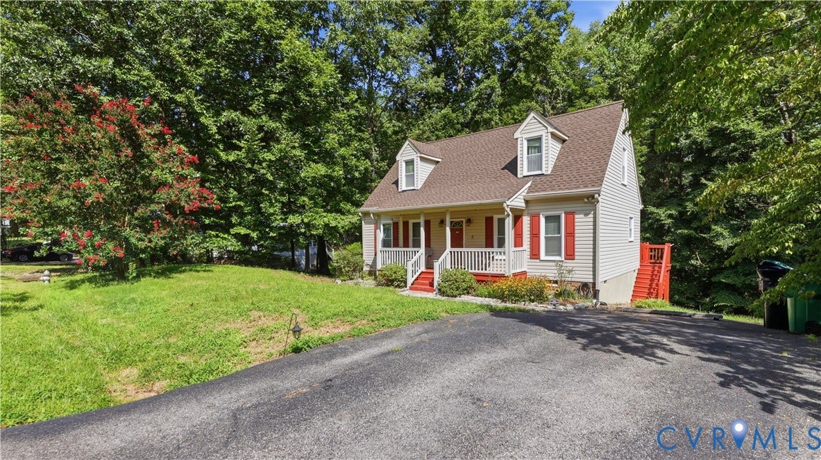 10208 Claybar Trail, Chesterfield, VA 23236 Cape Cod-style residence featuring a covered front porch, dual dormer windows, asphalt driveway, and exterior shutter accents