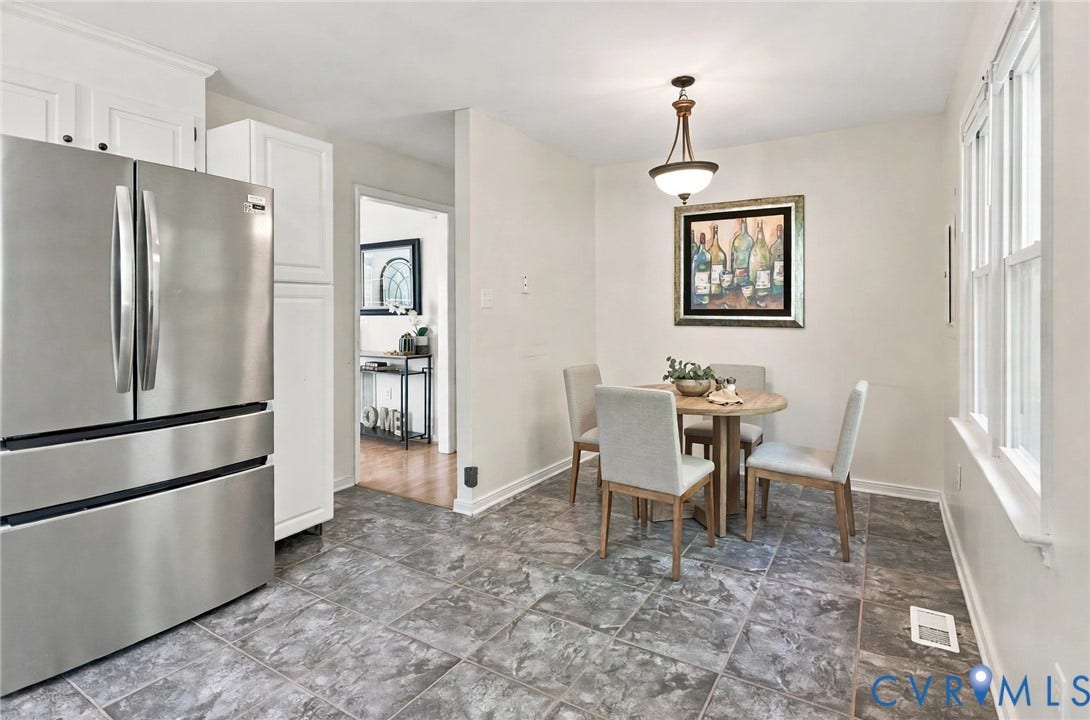 10208 Claybar Trail, Chesterfield, VA 23236 Eat-in area featuring ceramic tile flooring, shaker-style white cabinetry, stainless steel refrigerator, and pendant lighting