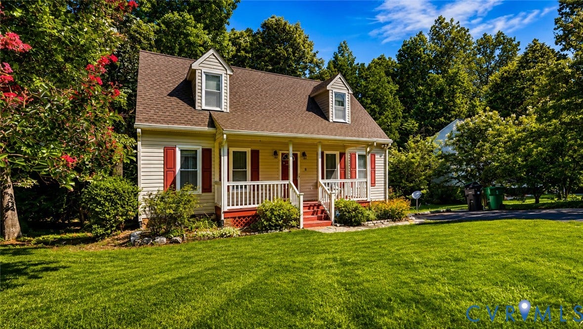 10208 Claybar Trail, Chesterfield, VA 23236 Cape Cod-style residence featuring horizontal siding, dual front-facing dormers, a covered front porch with railings, and decorative window shutters