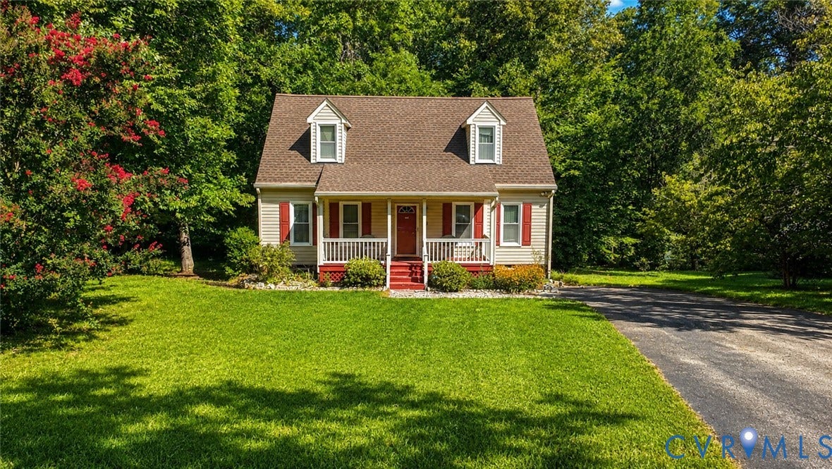 10208 Claybar Trail, Chesterfield, VA 23236 Cape Cod-style residence featuring light-colored siding, a covered front porch with railings, dormer windows, and a multi-gabled roofline